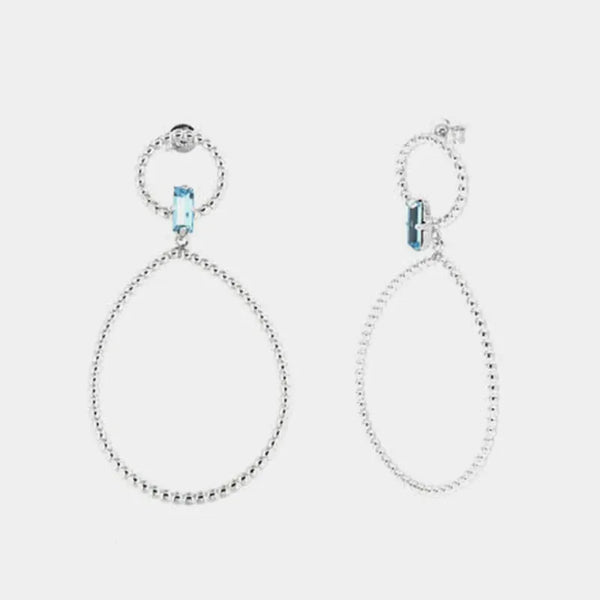 Orecchini in Argento 925 con doppi cerchi puntellati e cristallo azzurro centrale