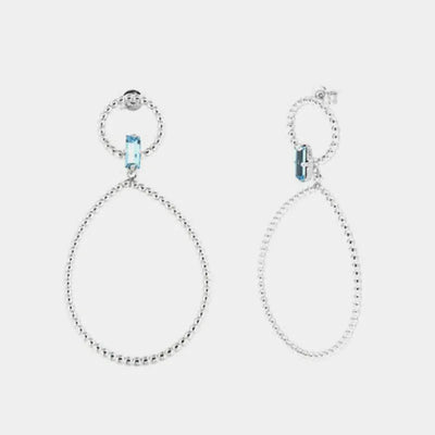 Orecchini in Argento 925 con doppi cerchi puntellati e cristallo azzurro centrale