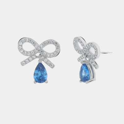Orecchini argento 925 con zircone azzurro pendente e fiocco zirconato - BYSIMON gioielli
