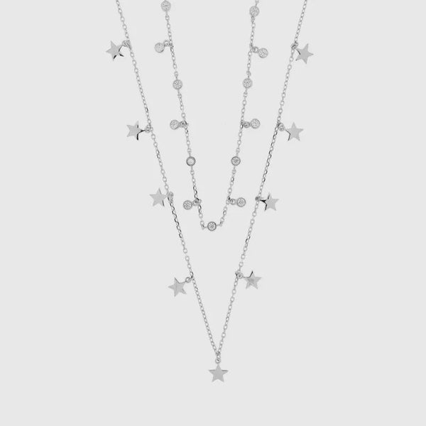 Sterling Silver double-chain necklace embellished with a row of star charms and dangling white cubic zirconia.
