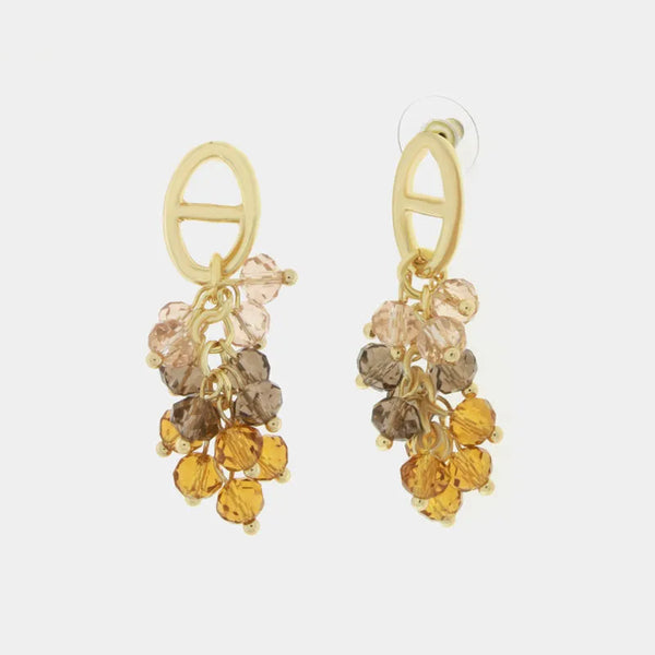 Metal earrings with yellow crystals