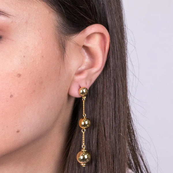 Metal earrings with hanging stones