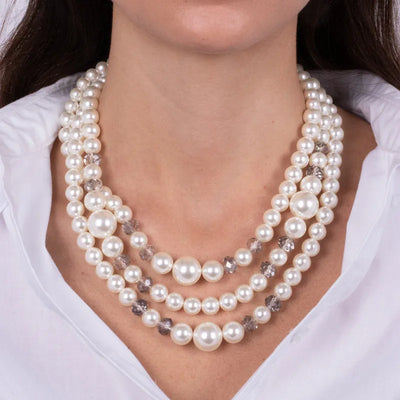 Multi-strand metal necklace with pearls