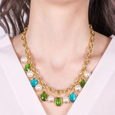 Metal necklace with blue and green crystals and synthetic pearls