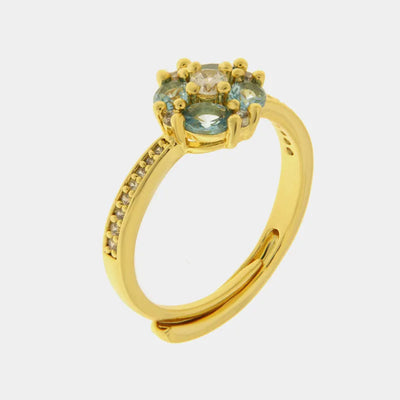 Metal ring with light blue zircon flower