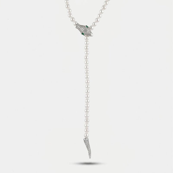 Collana in Metallo donna regolabile con filo di piccoli elementi sferici color avorio e pendente a forma di testa di serpente