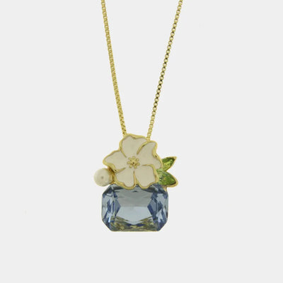 Collana in Metallo fiore bianco e cristallo azzurro