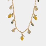 Collana in Metallo con charm a forma di limoni, arance e margherite