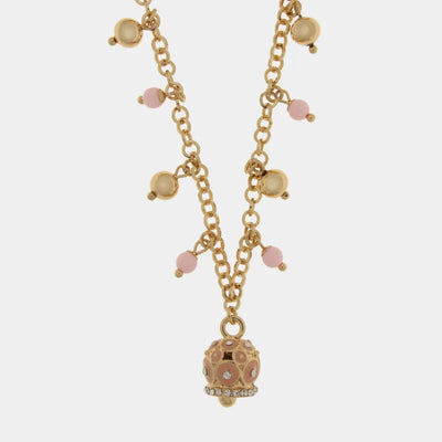 Metal necklace with colored spheres and a bell with pink circles and raised crystals
