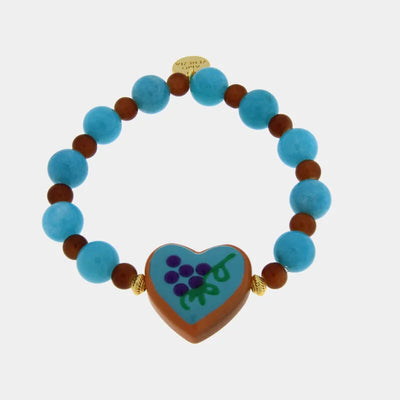 Bracciale in Metallo elastico con cuore turchese e perle rosse e azzurre