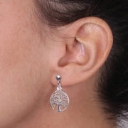 Orecchini in Argento 925 con alberi della vita a rami arricciati e punto luce di cristallo bianco.