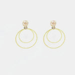 Orecchini in Argento 925 cerchi con cristalli champagne al lobo.