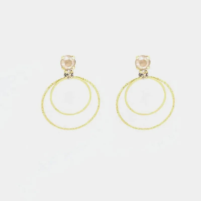 Orecchini in Argento 925 cerchi con cristalli champagne al lobo.