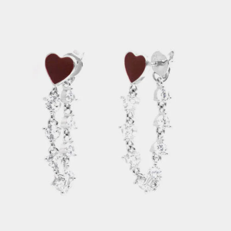 Orecchini in Argento 925 con cuore rosso smaltato e zirconi pendenti