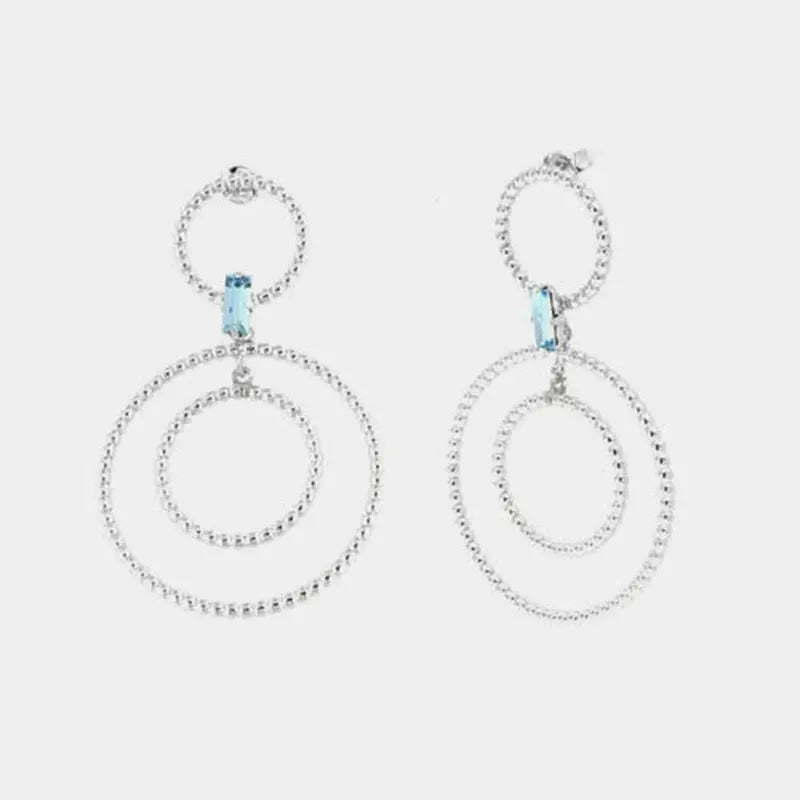 Orecchini in Argento 925 con doppi cerchi puntellati e cristallo azzurro centrale