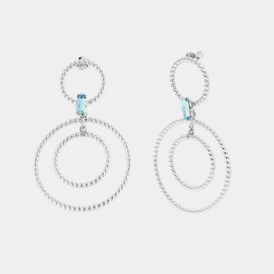 Orecchini in Argento 925 con doppi cerchi puntellati e cristallo azzurro centrale
