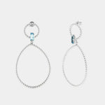 Orecchini in Argento 925 con doppi cerchi puntellati e cristallo azzurro centrale