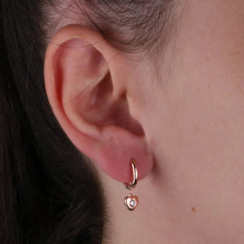 Sterling Silver hoop earrings with hearts embellished with white zircons