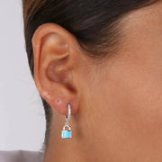 Orecchini in Argento 925 cerchietti impreziositi da zirconi bianchi e pendente a forma di lucchetto smaltato azzurro