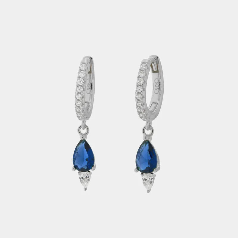 Orecchini in Argento 925 a cerchietto impreziosito da zirconi bianchi e zircone fucsia pendente