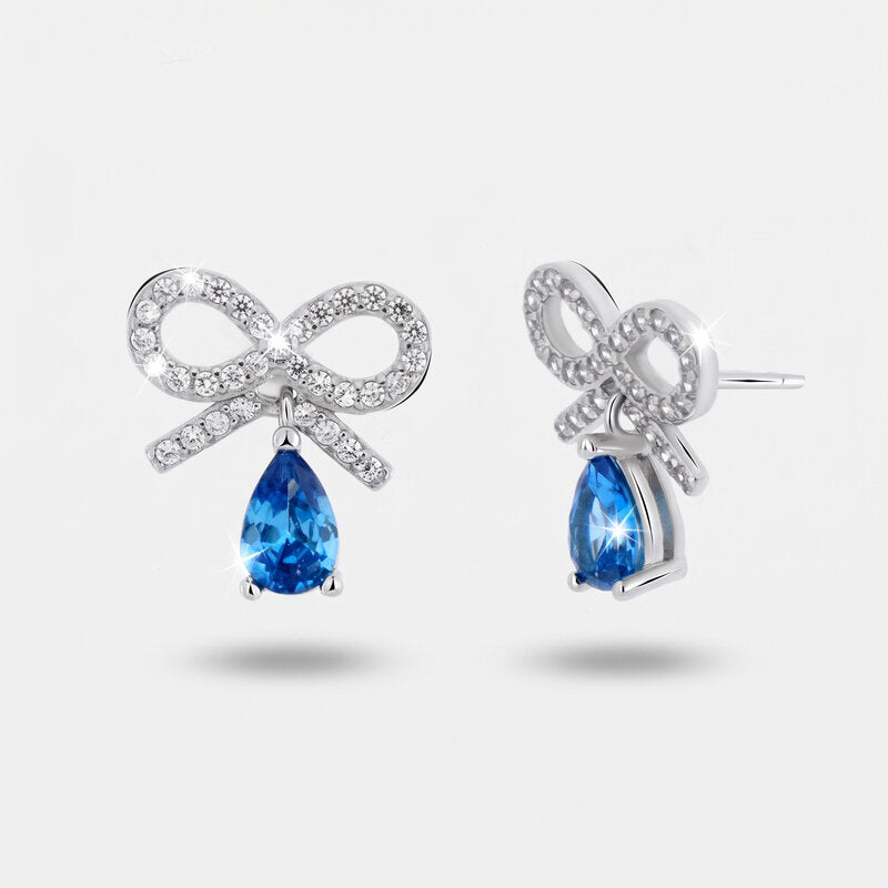 Orecchini argento 925 con zircone azzurro pendente e fiocco zirconato - BYSIMON gioielli