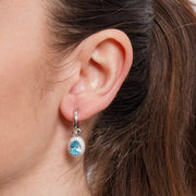 Orecchini in Argento 925 cerchietto con zircone azzurro pendente