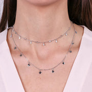Collana in Argento 925 a doppia catena impreziosita da giro di stelline e zirconi bianchi pendenti