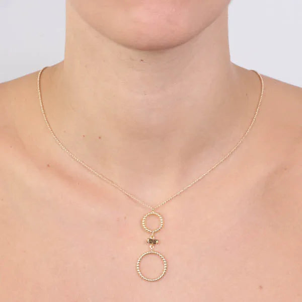 Collana in Argento 925 con doppi cerchi puntellati, impreziositi da cristallo centrale, colorazione topazio
