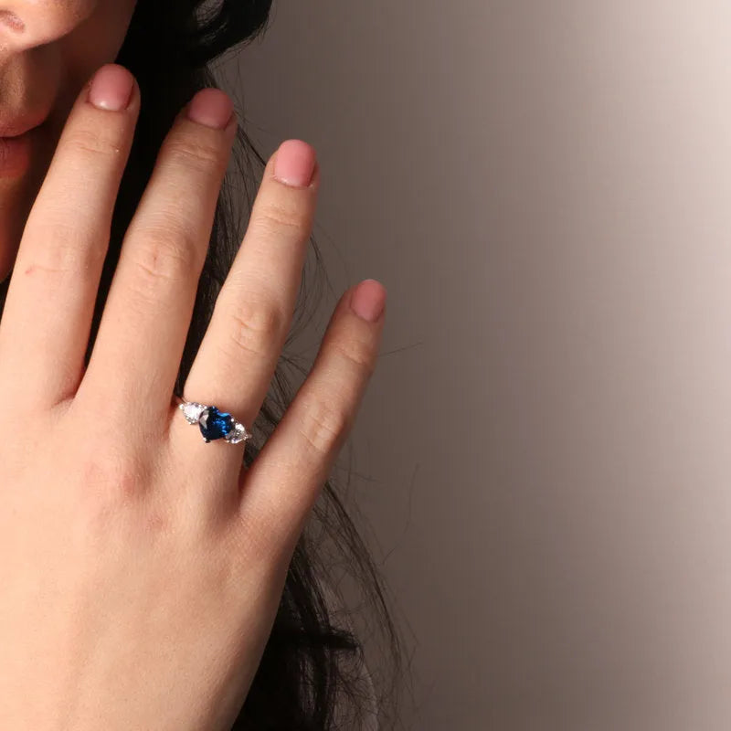 925 Silver ring with hearts in white and blue zircons