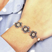 Bracciale in Argento 925  a forma di rose con cristalli fume' e bianchi