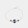 Bracciale in Argento 925 con cristallo dalla colorazione blu denim centrale e doppio punto luce rosa antico ai lati