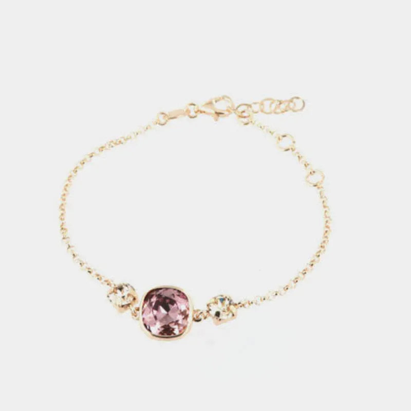 Bracciale in Argento 925 con cristallo dalla colorazione rosa antico centrale e doppio punto luce ai lati
