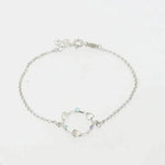 Bracciale in Argento 925 con cerchio impreziosito da cuori e cristalli colorati alternati.