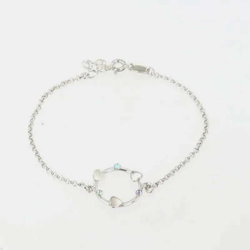 Bracciale in Argento 925 con cerchio impreziosito da cuori e cristalli colorati alternati.