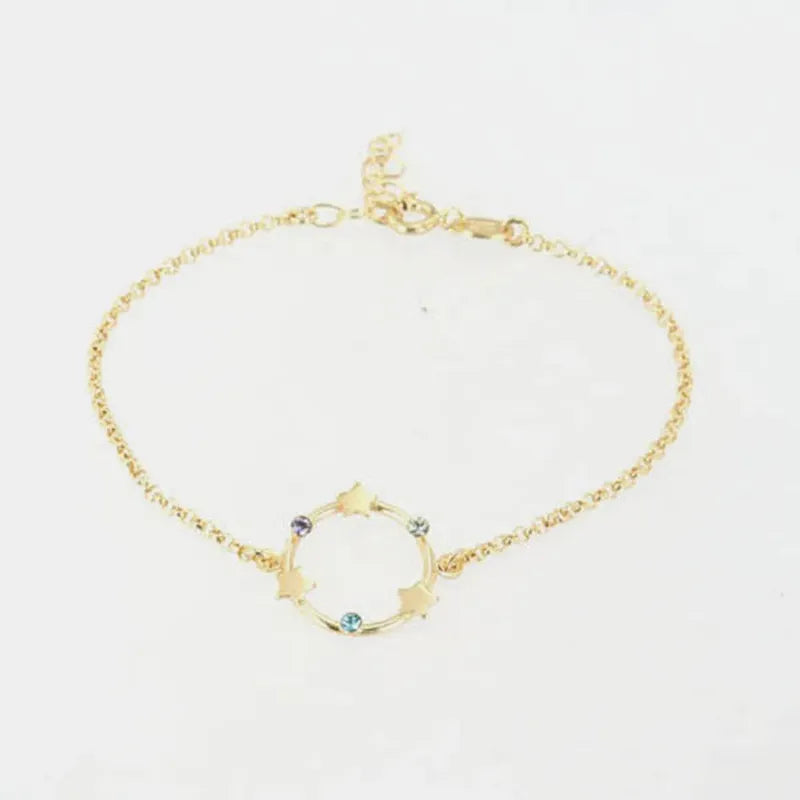 Bracciale in Argento 925 con cerchio impreziosito da stelle e cristalli colorati alternati.