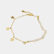Bracciale in Argento 925 con alternanza di perle barocche e stelle pendenti