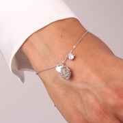Bracciale in Argento 925 con pigna portafortuna impreziosito da zirconi bianchi e cuore pendente