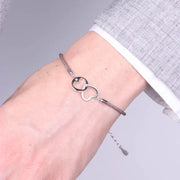 Bracciale in Argento 925 con cuori intrecciati e cordino