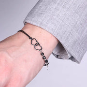 Bracciale in Argento 925 cuori intrecciati e cordino nero