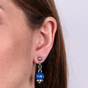 Orecchini in Acciaio con campanella blu e scritta Capri