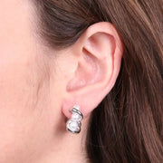 Orecchini in Acciaio semicerchio intrecciato con perle