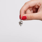 Ciondolo in Acciaio campanella scritta Capri e zirconi