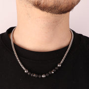 Collana in Acciaio tramatura in acciaio con dettaglio in sfere color lava