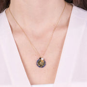 Collana in Acciaio con pendente cerchio e perline blu