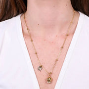 Collana in Acciaio con campanella  placcata oro   con scritta Capri