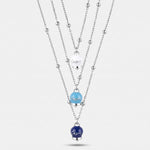 Collana in Acciaio Multifilo con Tris di Campanelle Portafortuna Capri tonalità blu, azzurra, bianca - gioiello BySimon