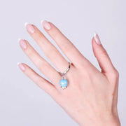 Anello in Acciaio con campanella pendente azzurra  con scritta Capri