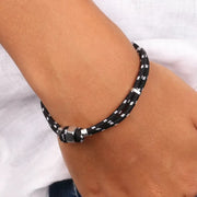 Bracciale in Acciaio in tessuto nero e bianco con bullone centrale in acciaio