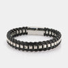 Bracciale in Acciaio rigido in pelle nera intrecciata con una catena in metallo lucido. Chiusura a scomparsa