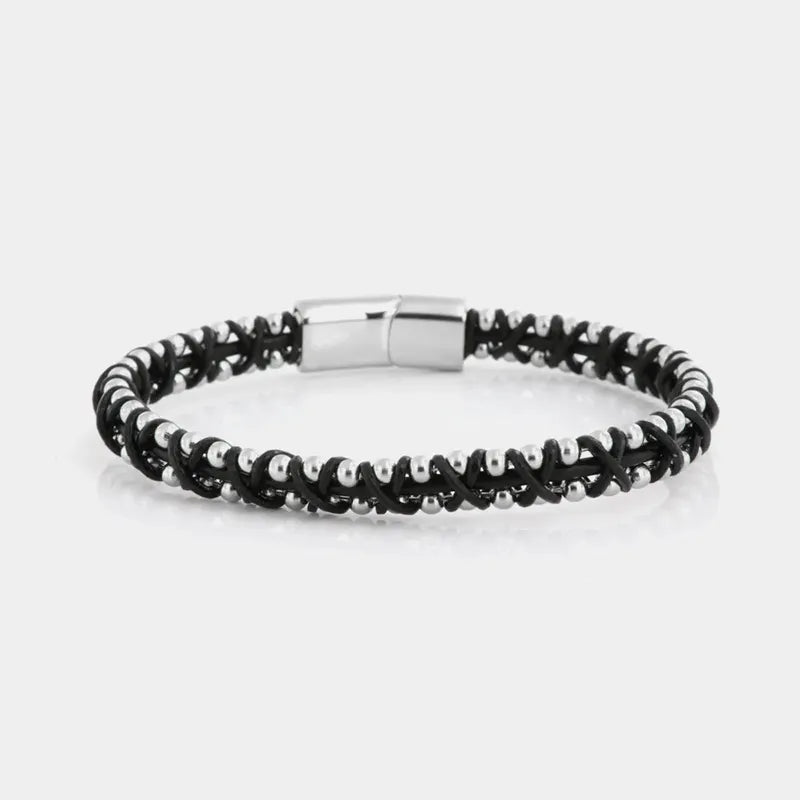 Bracciale in Acciaio rigido in corda nera intrecciata insieme a sferette in metallo lucido. Chiusura a scomparsa